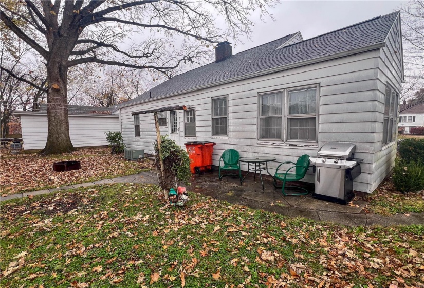 Back of property featuring central air condition unit